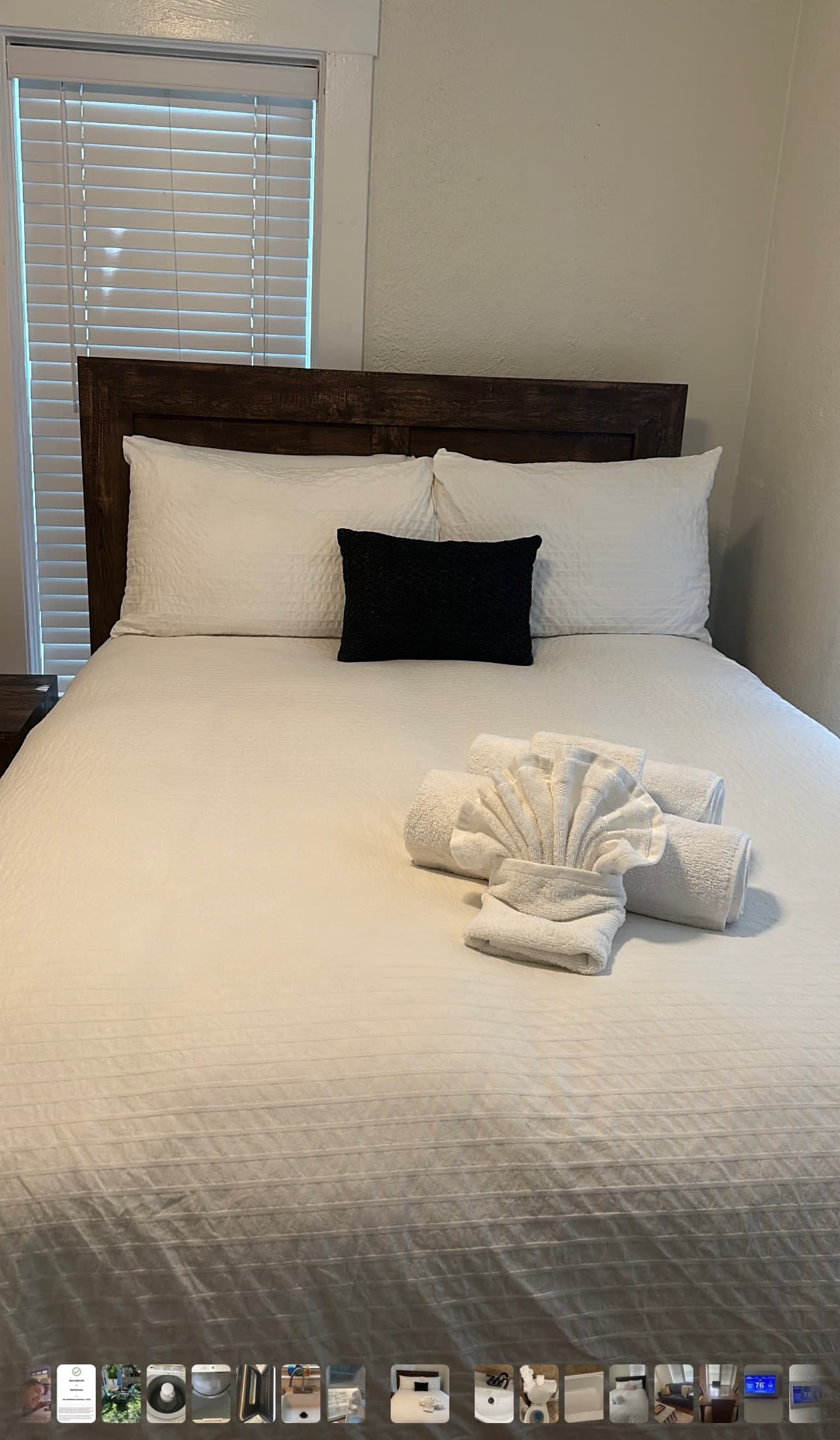 Perfectly made bed with towel art